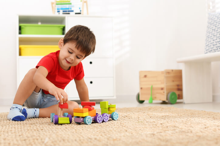 3 year old boy playing with toys